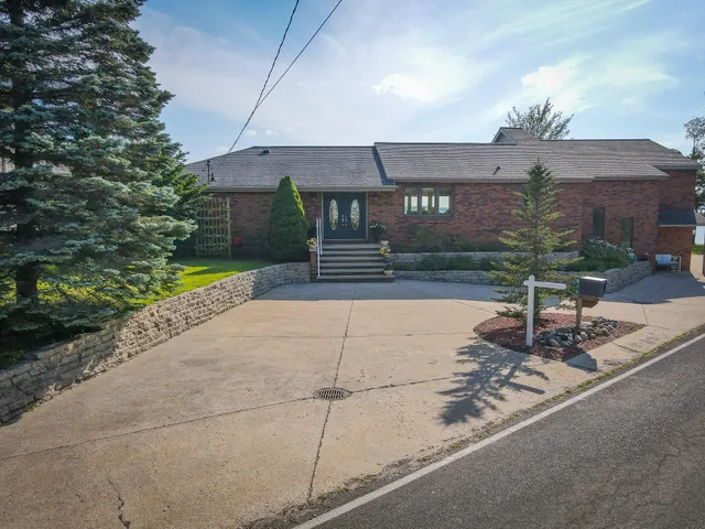 $1,200,000 | 815 East Lake Mitchell Drive, Cadillac, MI 49601