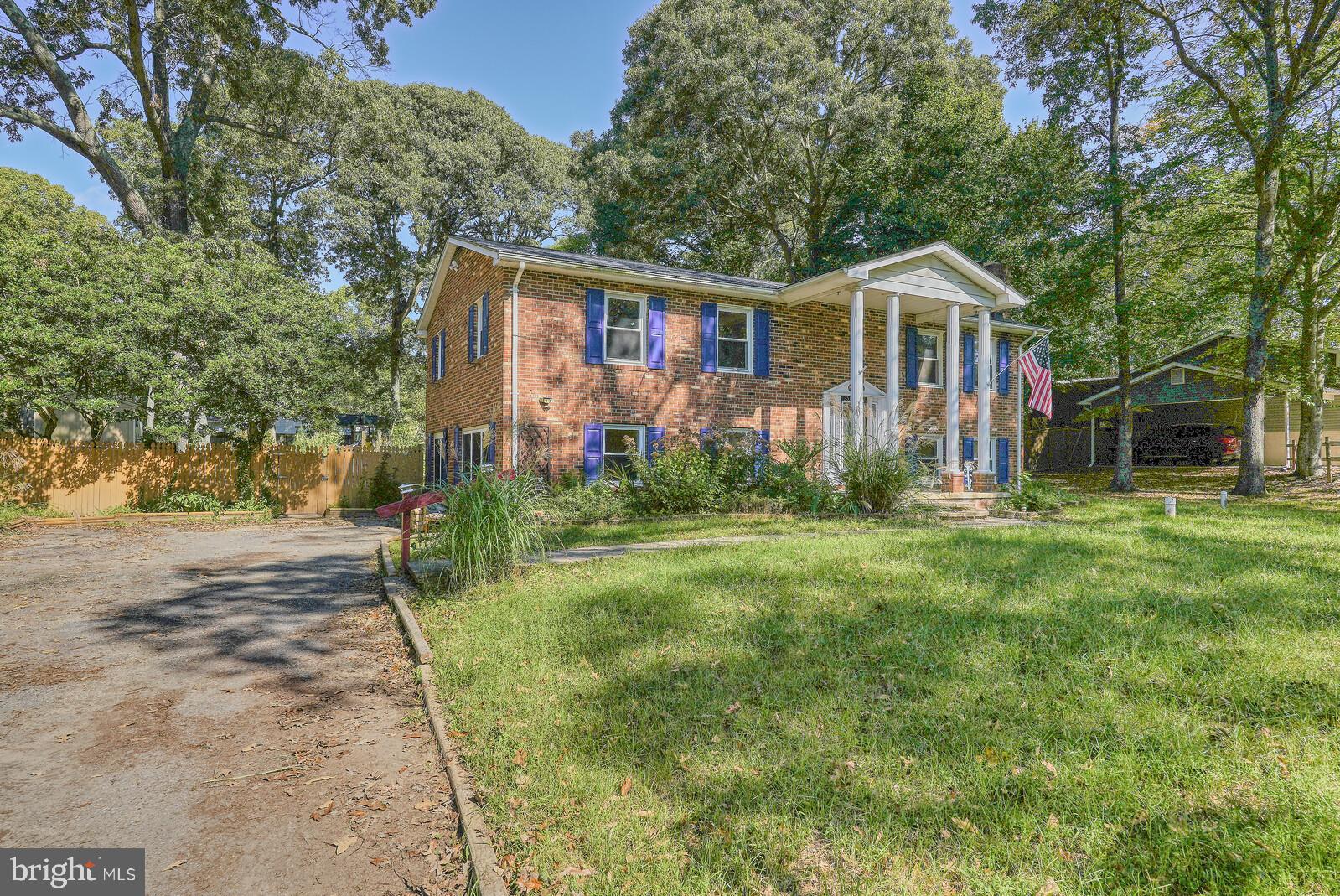 1142 Calvert Beach Road St. Leonard, MD 20685 - Photo 7 of 63 a front view of house with yard and green space