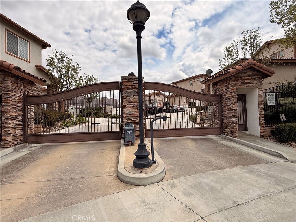 585 Vía Pueblo Riverside, CA 92507 - Photo 4 of 61 Outside view of gated community.
