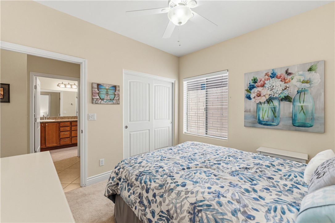 3315 Rainbow Mine Road Kingman, AZ 86401 - Photo 36 of 54 This room features carpeted flooring, a ceiling fan, and a window with blinds