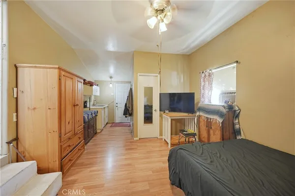 a bed room with a bed and a television