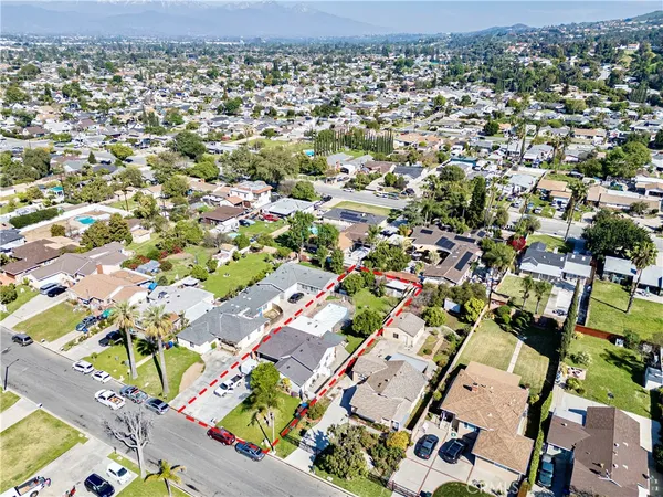 an aerial view of residential houses with outdoor space
