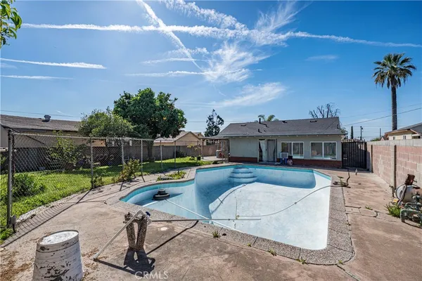 a view of a swimming pool with a patio