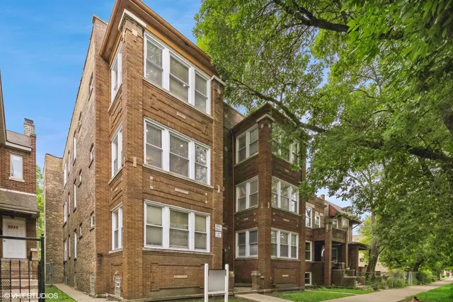 a front view of a multi story residential apartment building