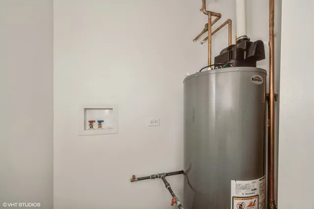 a view of storage and utility room with a door