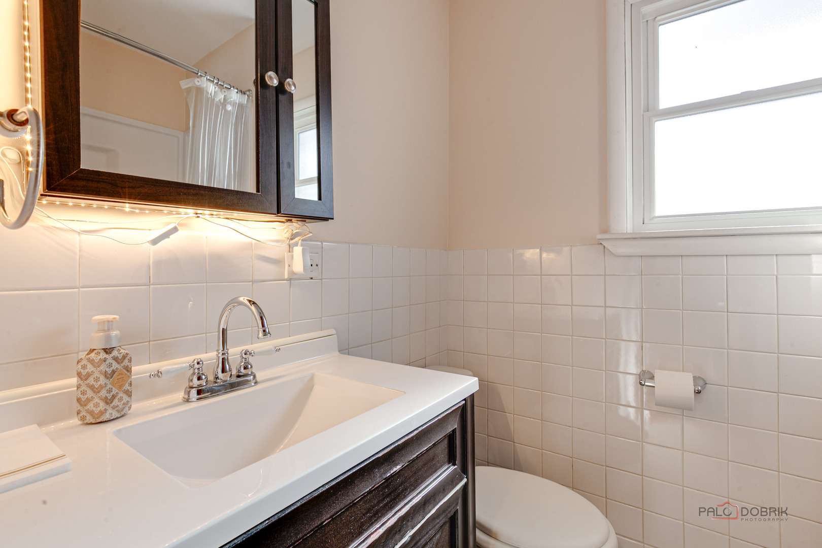 15983 West Wadsworth Road Wadsworth, IL 60083 - Photo 13 of 32 a bathroom with a sink a toilet and mirror