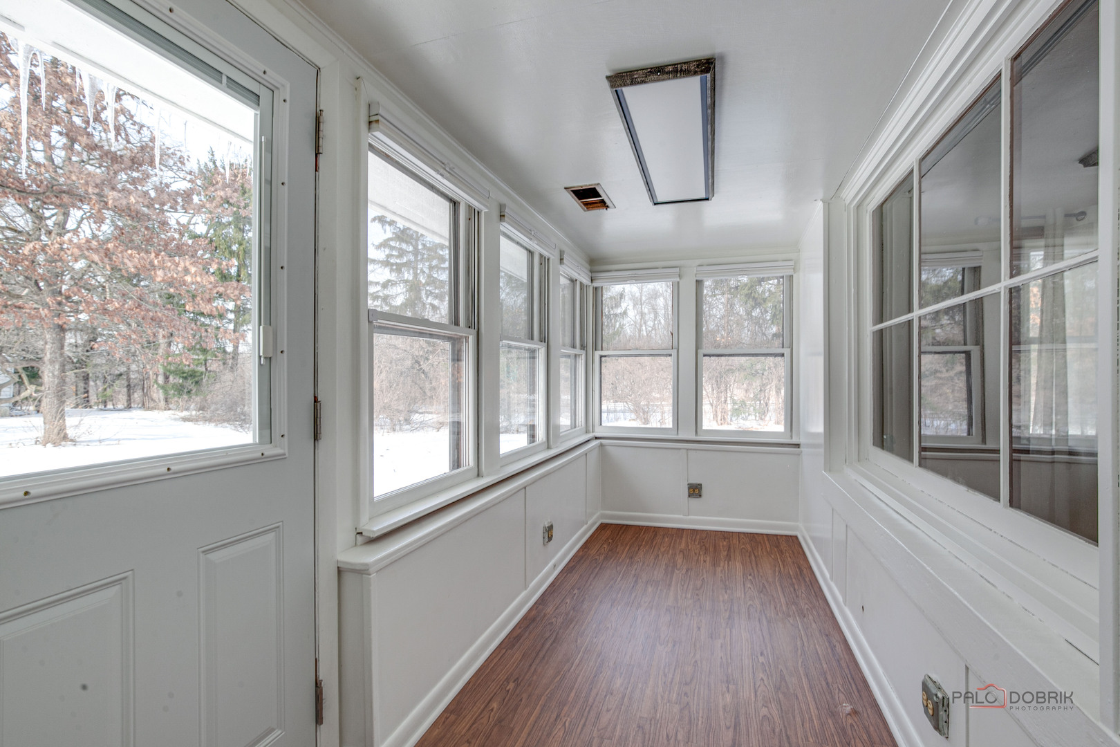 15983 West Wadsworth Road Wadsworth, IL 60083 - Photo 16 of 32 a view of an empty room with wooden floor and a window