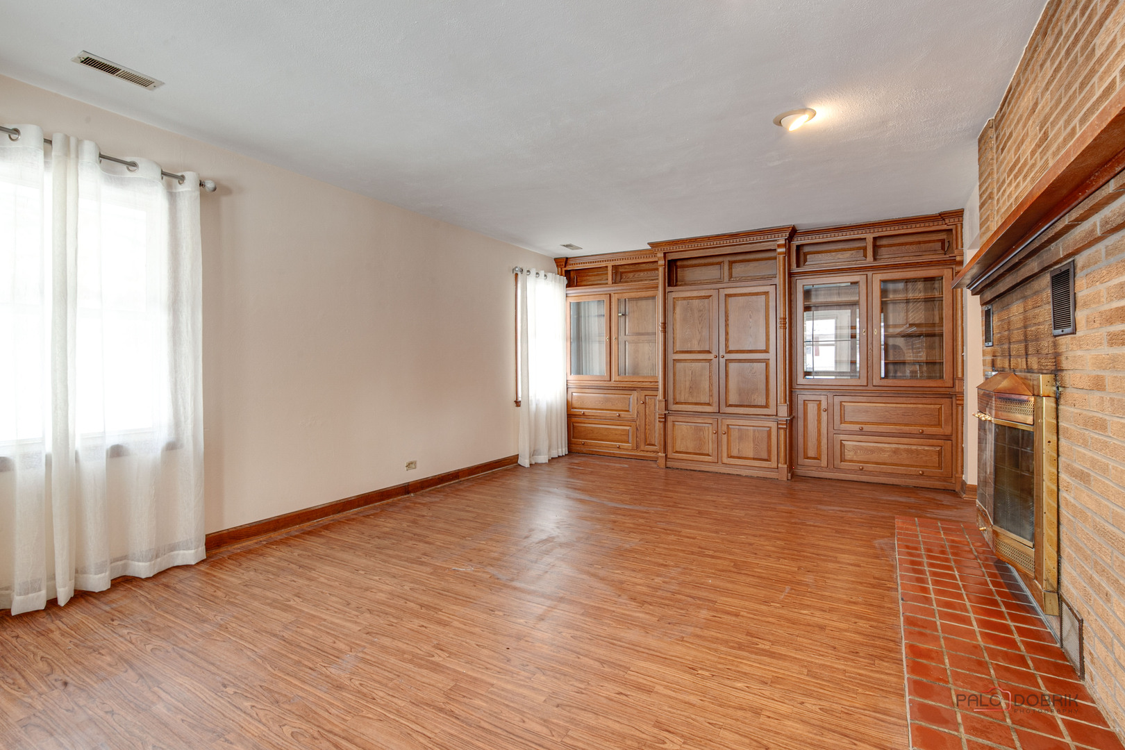 15983 West Wadsworth Road Wadsworth, IL 60083 - Photo 2 of 32 a view of an empty room with window and wooden floor
