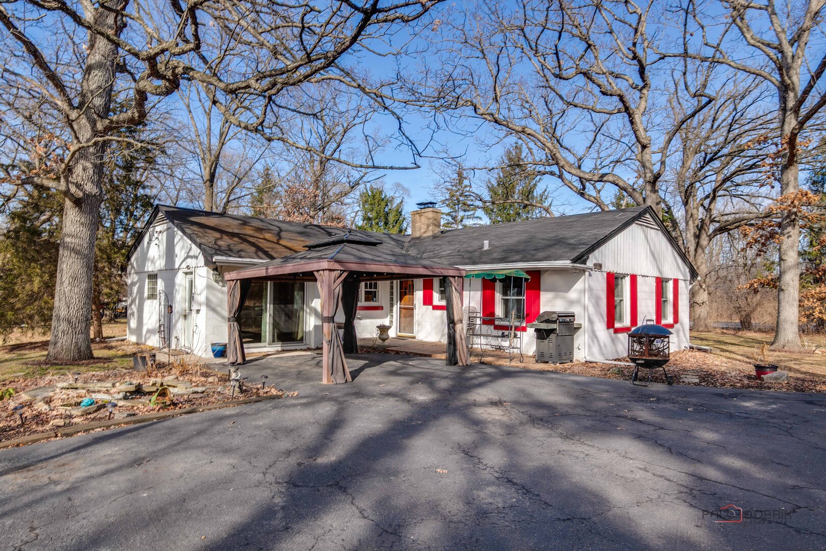 15983 West Wadsworth Road Wadsworth, IL 60083 - Photo 21 of 32 a view of a building with large trees