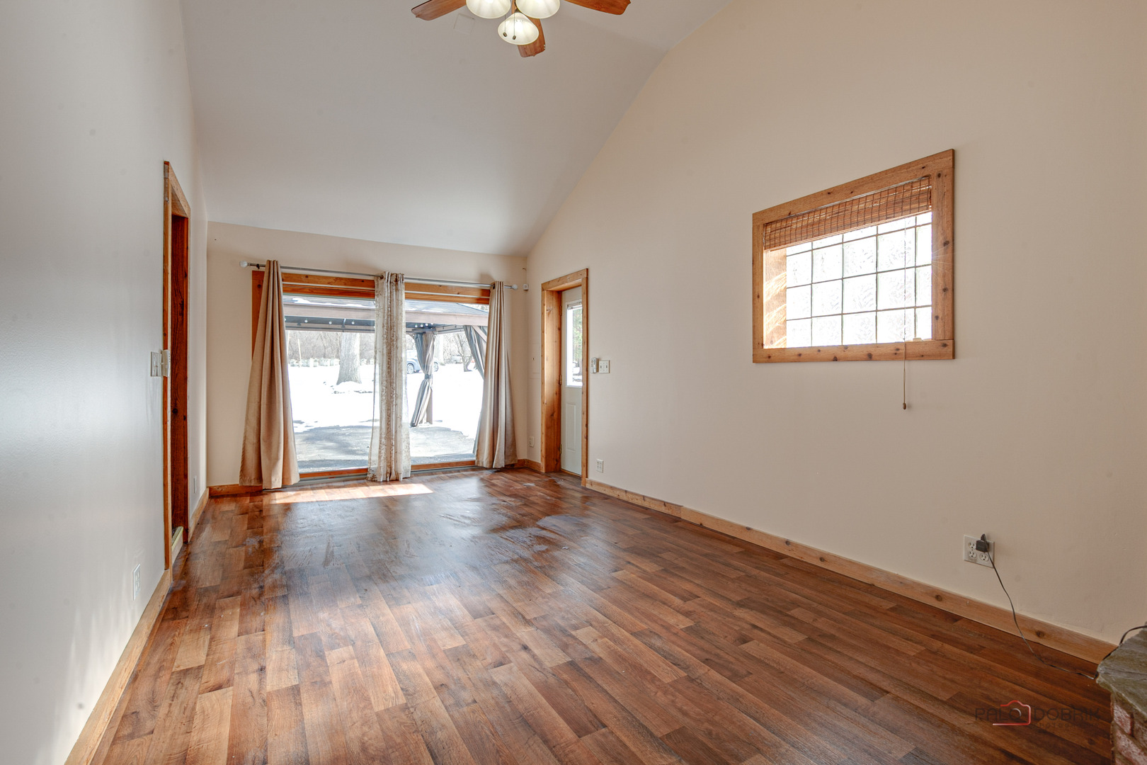 15983 West Wadsworth Road Wadsworth, IL 60083 - Photo 9 of 32 a view of an empty room with wooden floor and a window