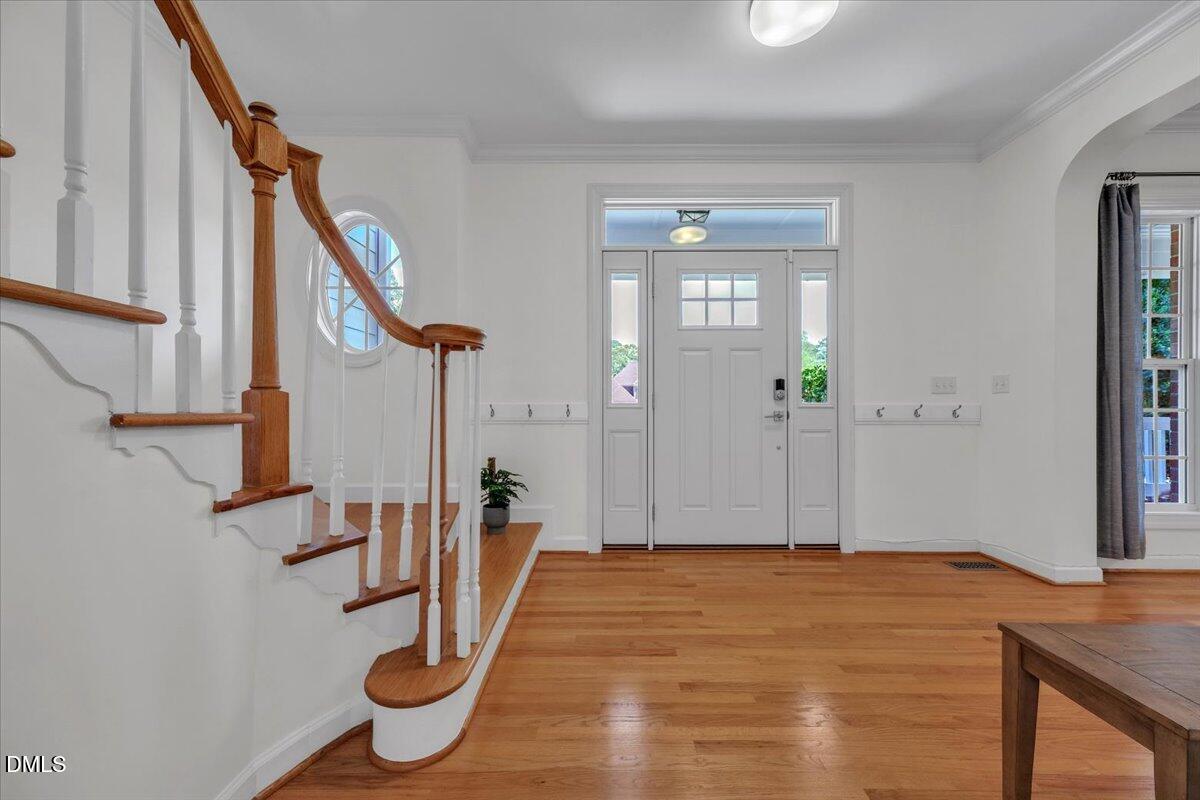 2908 Oak Bridge Drive Raleigh, NC 27610 - Photo 8 of 47 a view of entryway with wooden floor
