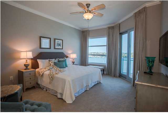211 Durango Road, Unit 713 Destin, FL 32541 - Photo 12 of 30 a bedroom with a bed a window and a chandelier