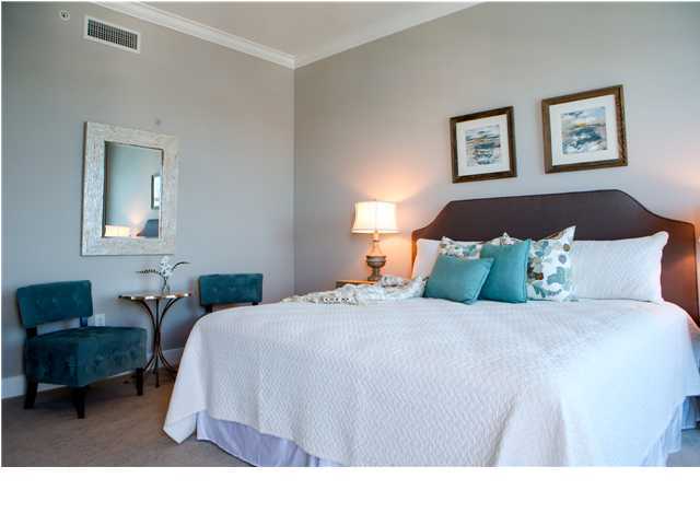 211 Durango Road, Unit 713 Destin, FL 32541 - Photo 13 of 30 a bedroom with a bed a couch and a painting on the wall