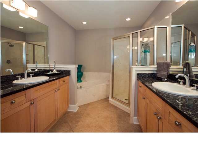 211 Durango Road, Unit 713 Destin, FL 32541 - Photo 14 of 30 a bathroom with a sink double vanity granite tub shower and a mirror