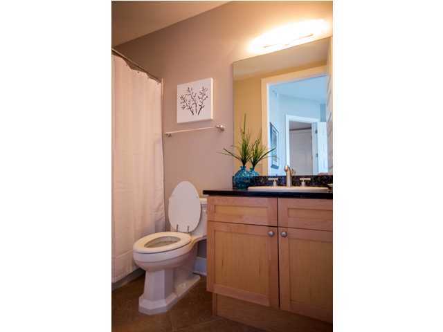 211 Durango Road, Unit 713 Destin, FL 32541 - Photo 17 of 30 a bathroom with a toilet a sink and a mirror
