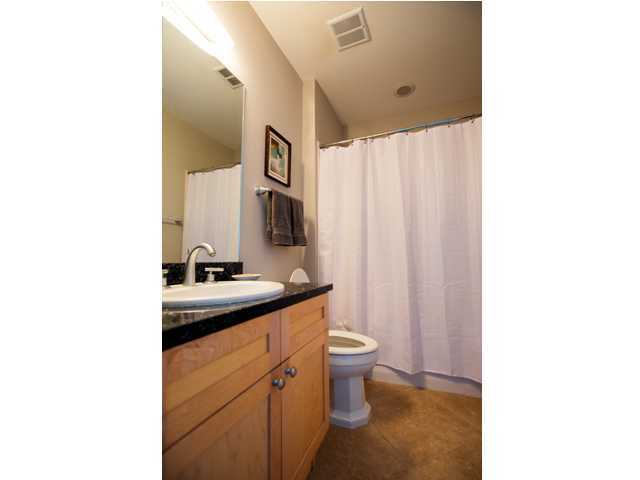 211 Durango Road, Unit 713 Destin, FL 32541 - Photo 21 of 30 a bathroom with a toilet sink and mirror