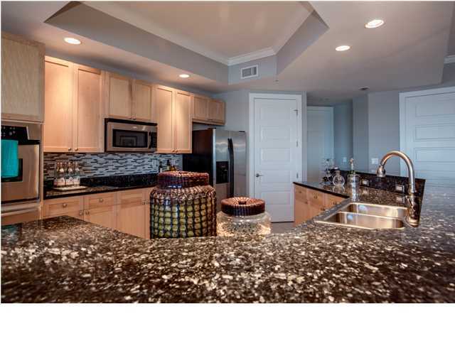 211 Durango Road, Unit 713 Destin, FL 32541 - Photo 10 of 30 a kitchen with sink a stove and refrigerator
