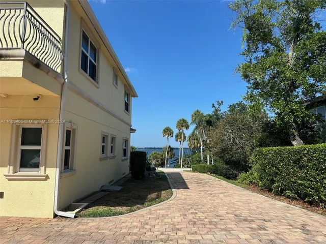 a view of a swimming pool with an outdoor seating and yard