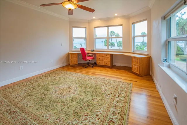 a view of living room with furniture and wooden floor