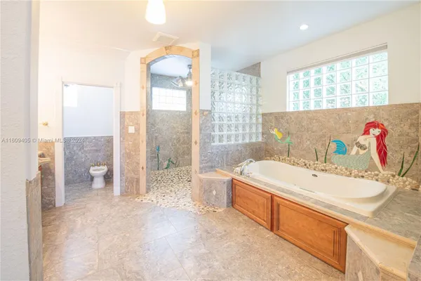 an aerial view of a house with yard swimming pool and outdoor seating