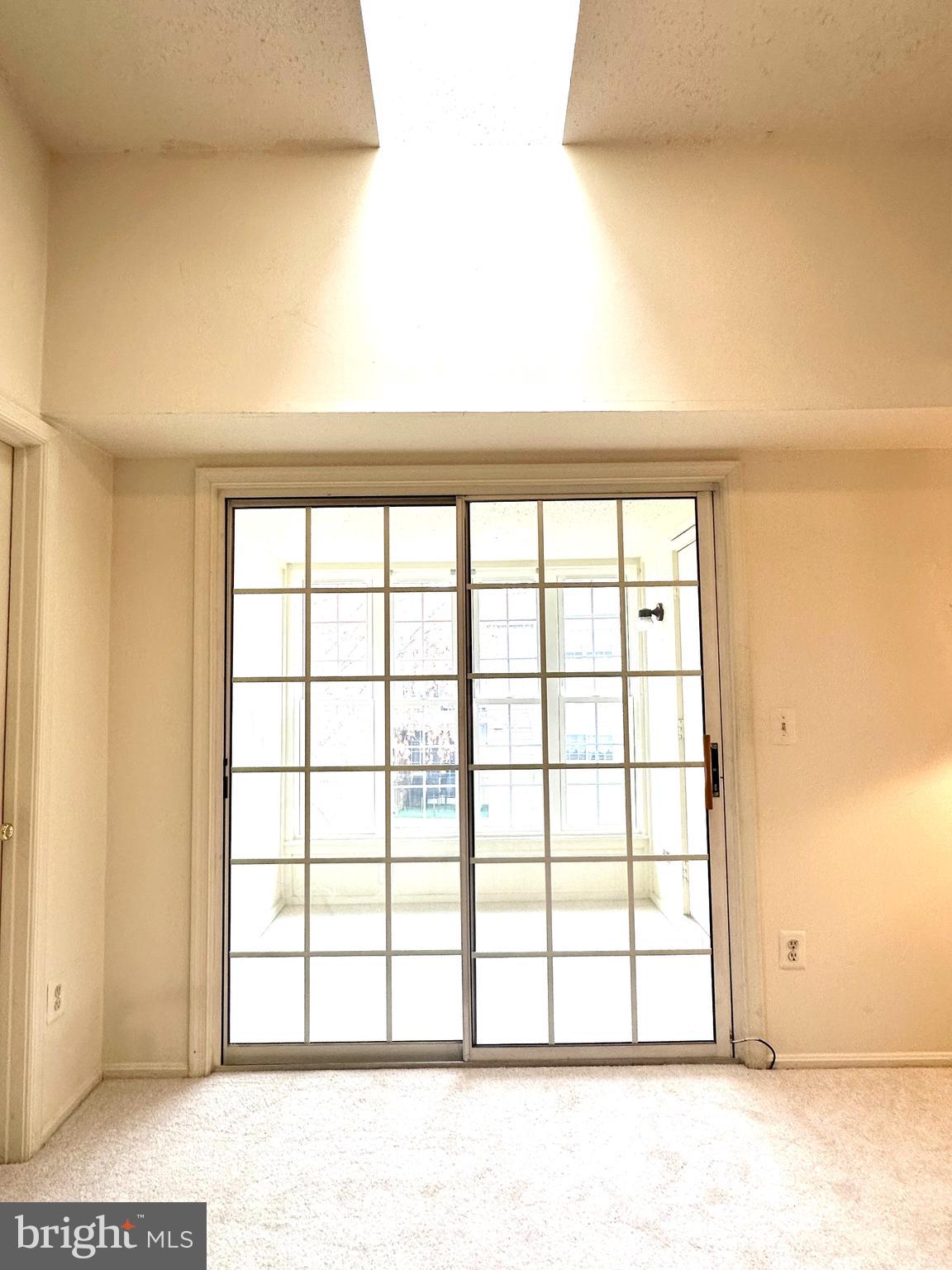 110 Fort Evans Road Southeast, Unit F Leesburg, VA 20175 - Photo 5 of 19 Double sliding doors that open to sunroom