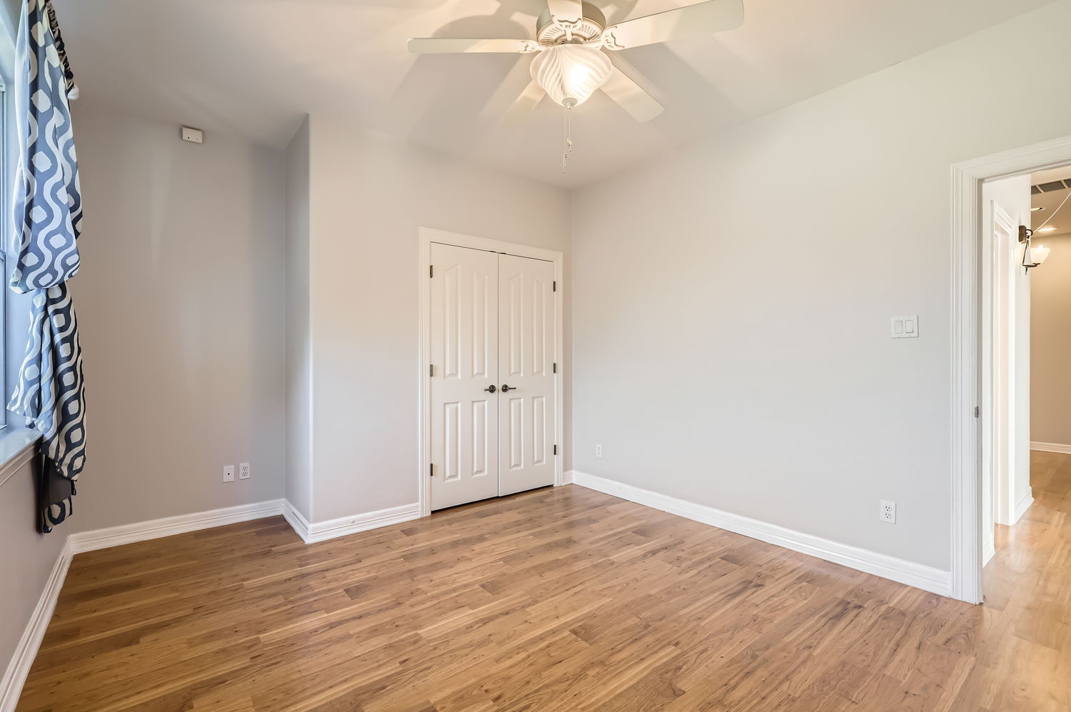 210 Amandas Way Leander, TX 78641 - Photo 25 of 38 Unfurnished bedroom featuring a closet, light wood-type flooring, and baseboards