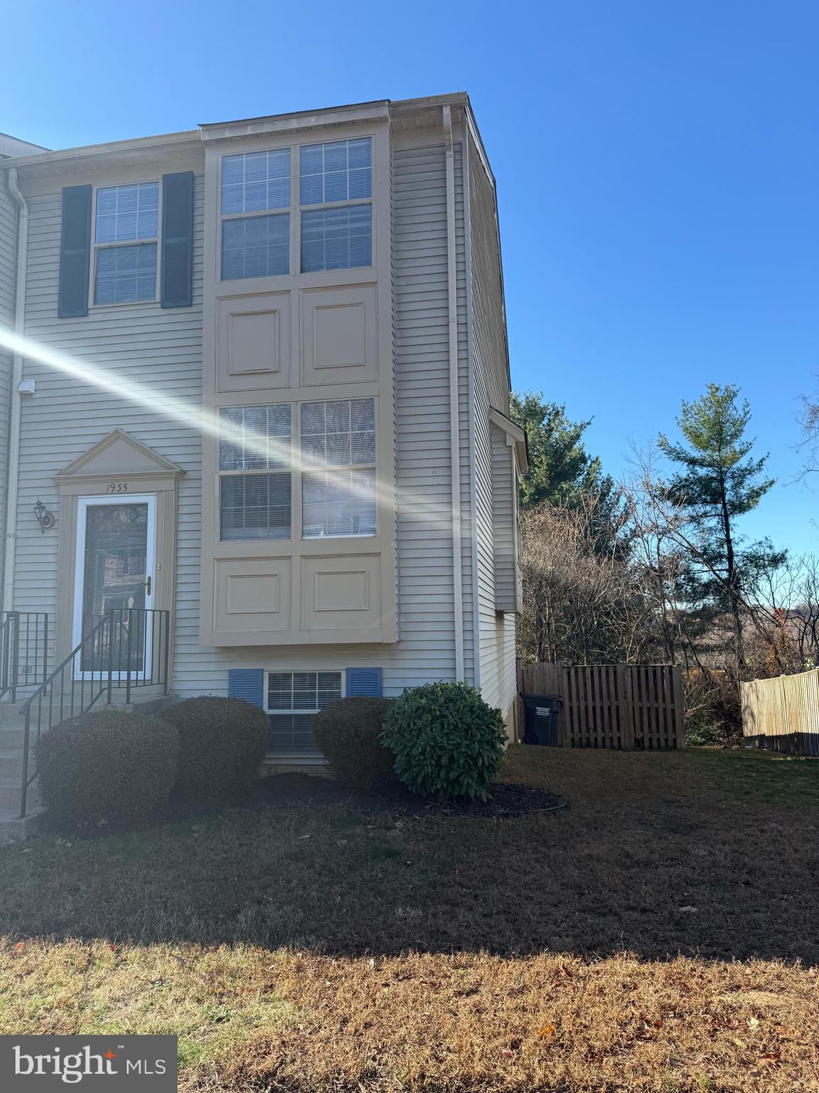 1935 Winslow Court Woodbridge, VA 22191 - Photo 2 of 34 a front view of a house with a garden