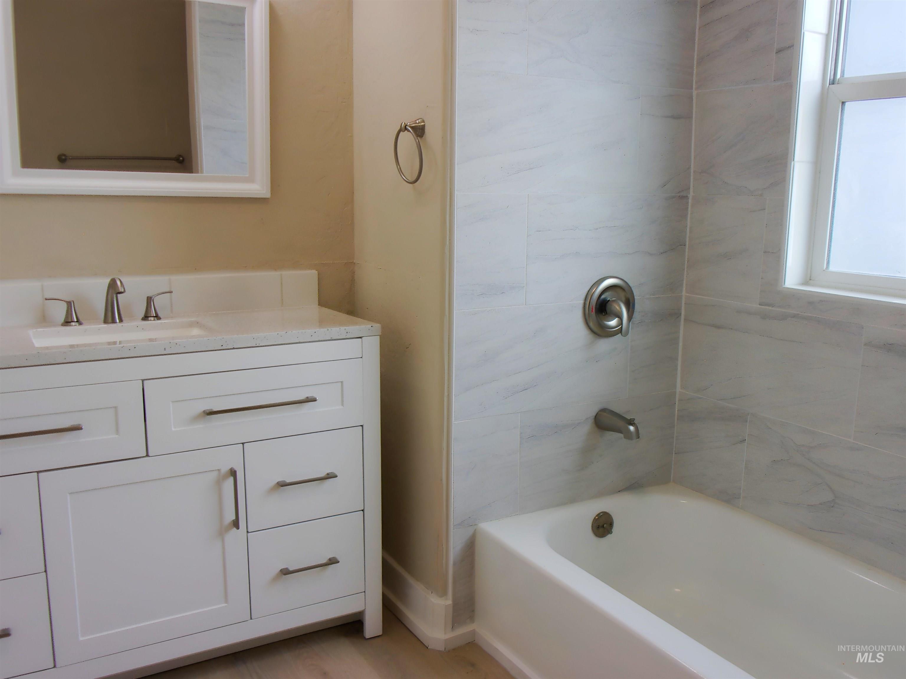 605 North 6th Street Parma, ID 83660 - Photo 16 of 46 Full bathroom featuring vanity and bathing tub / shower combination