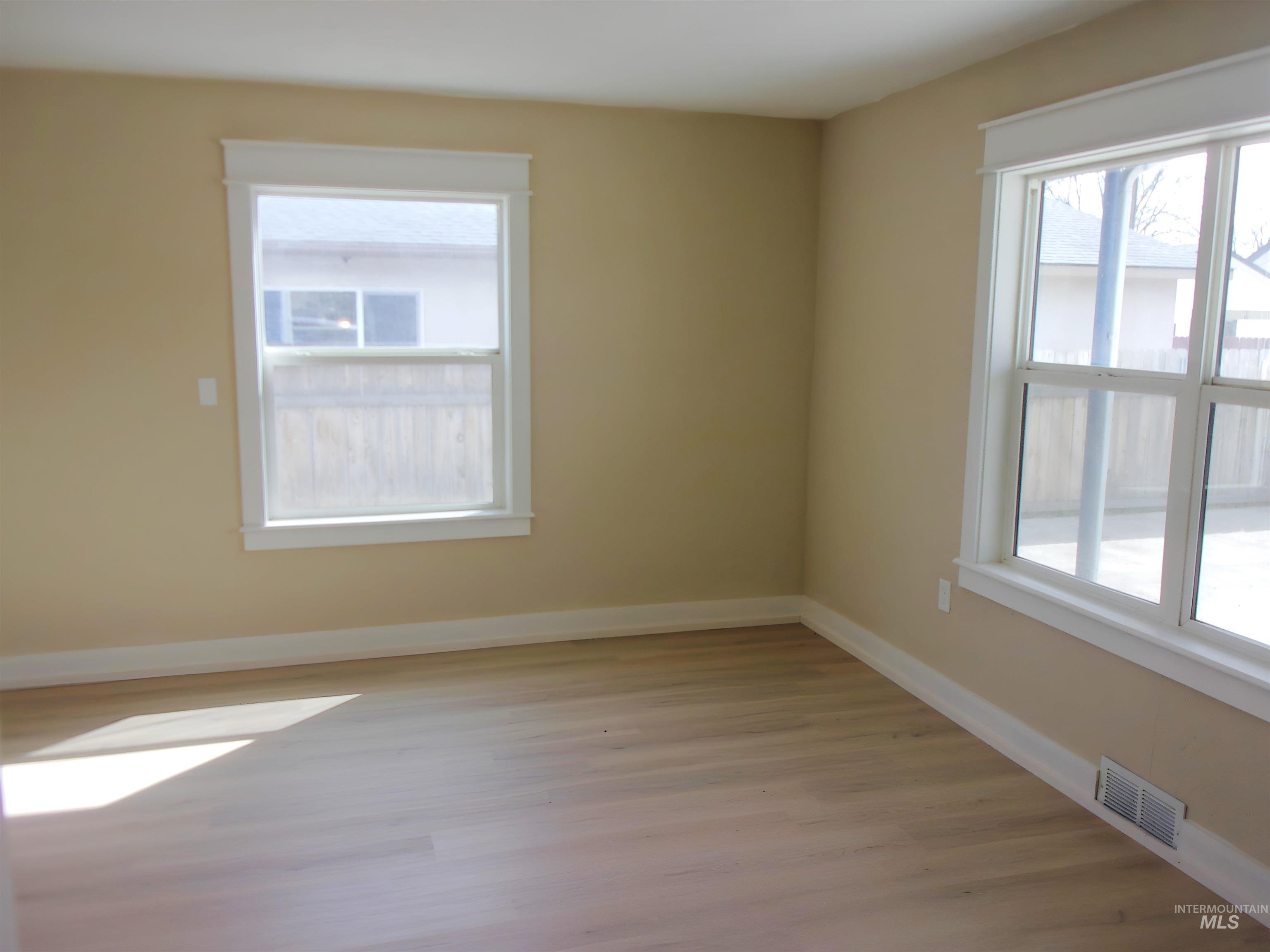 605 North 6th Street Parma, ID 83660 - Photo 19 of 46 Unfurnished room with baseboards and light wood-style flooring