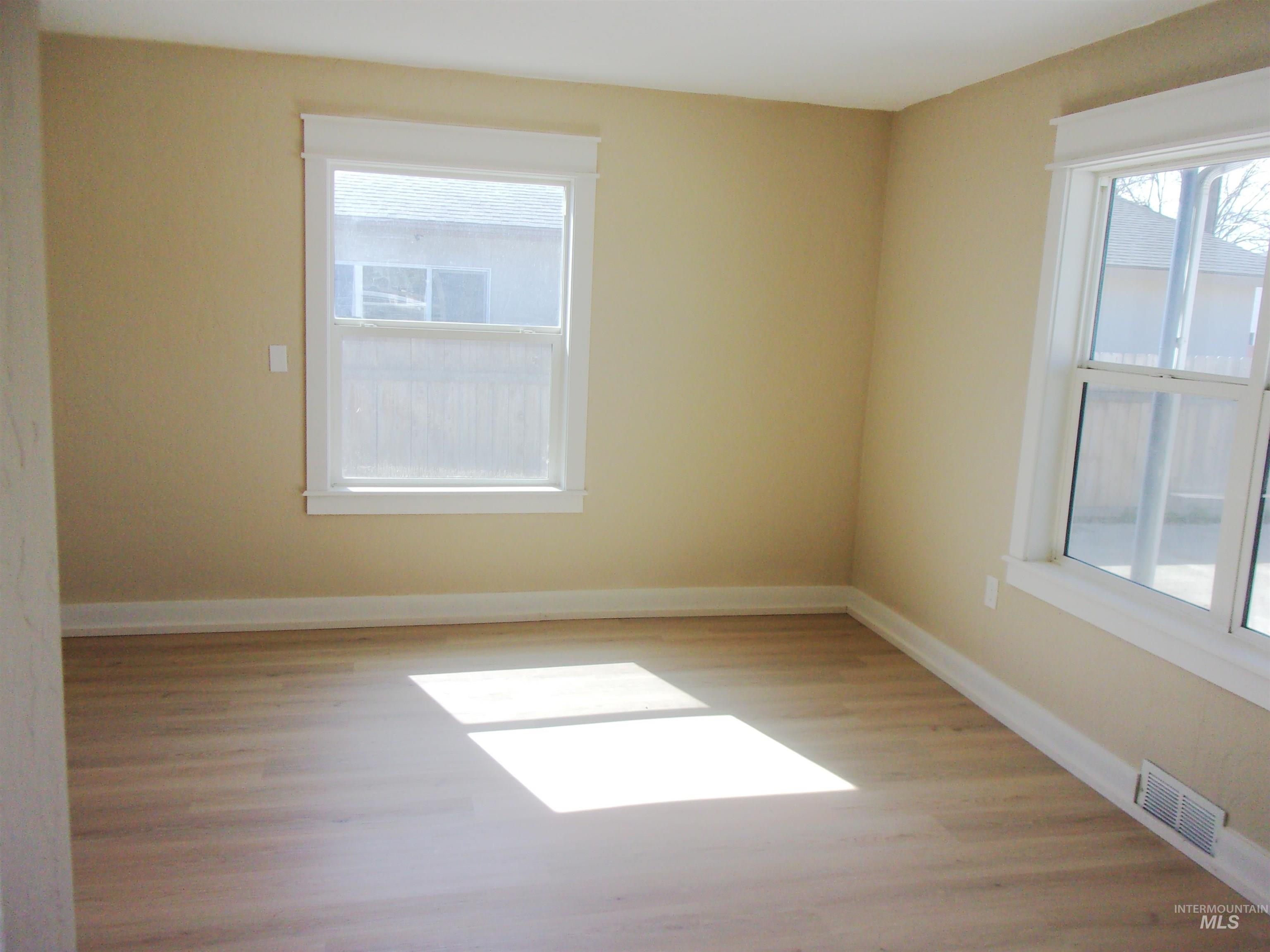 605 North 6th Street Parma, ID 83660 - Photo 20 of 46 Spare room with light wood finished floors and baseboards