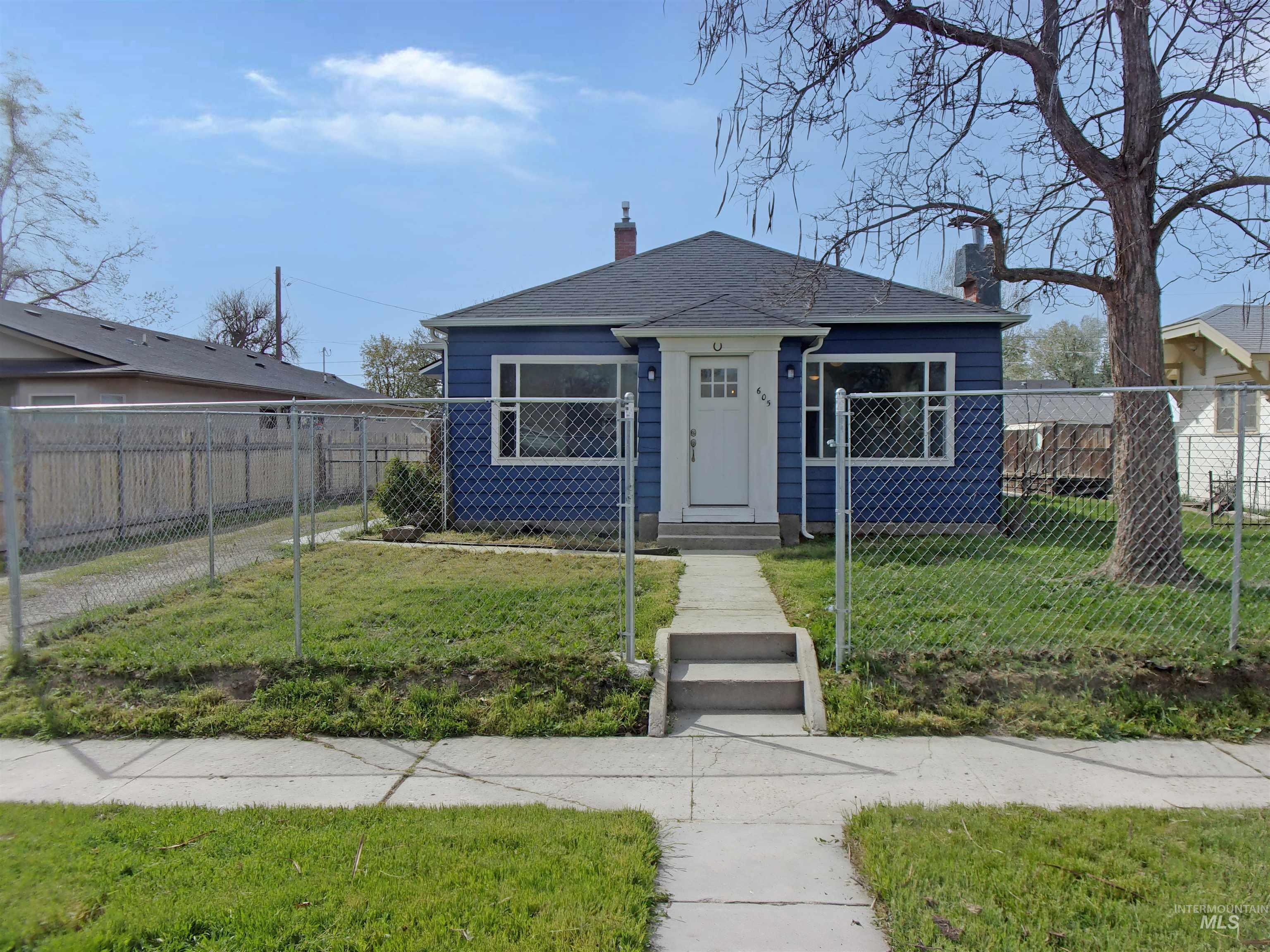 605 North 6th Street Parma, ID 83660 - Photo 2 of 46 View of front of property with a chimney and roof with shingles