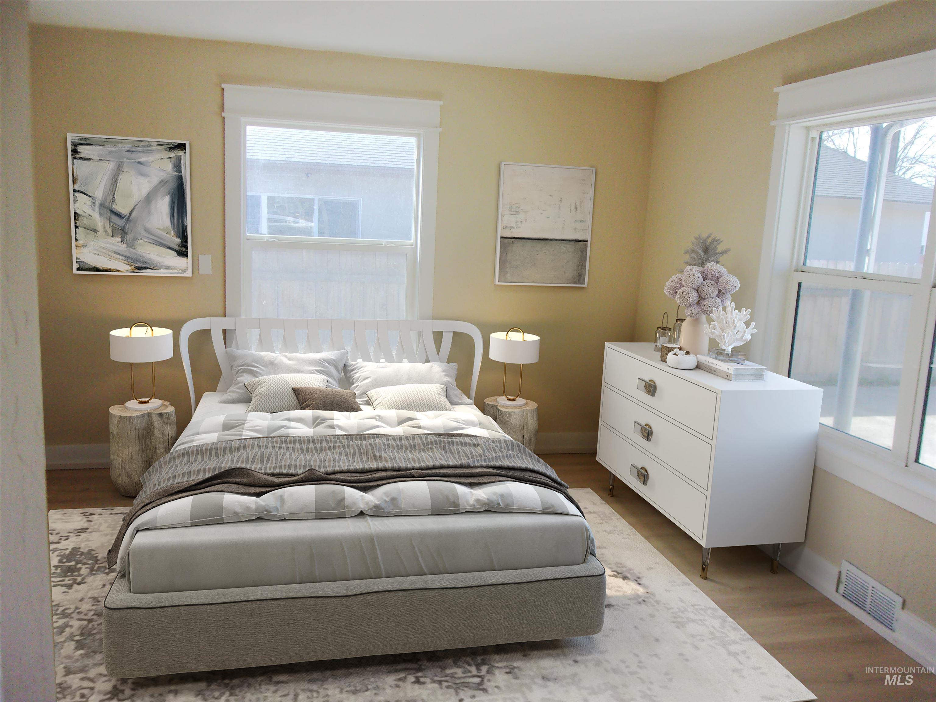 605 North 6th Street Parma, ID 83660 - Photo 21 of 46 Bedroom featuring baseboards and light wood-style floors