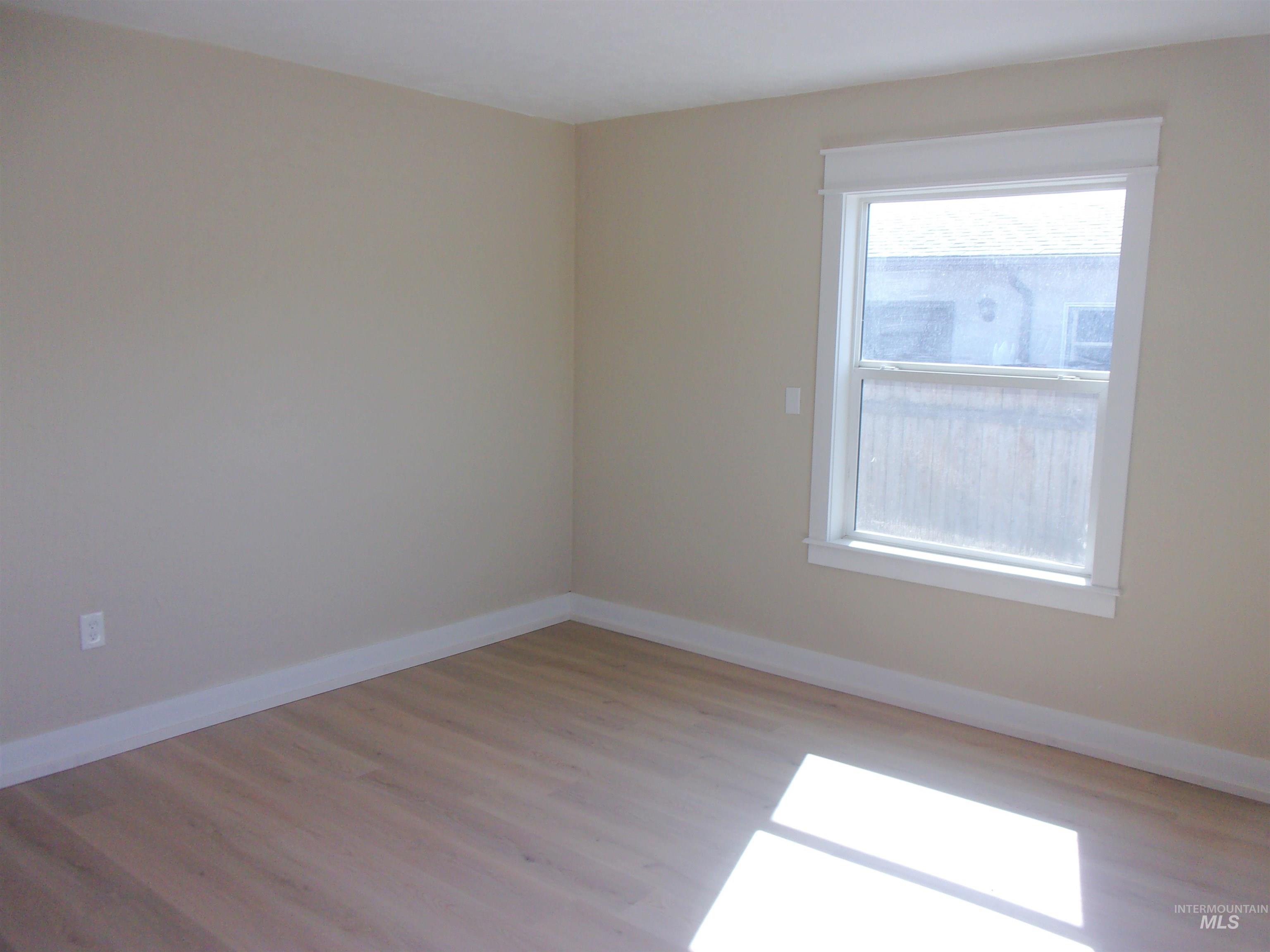605 North 6th Street Parma, ID 83660 - Photo 22 of 46 Spare room with baseboards and light wood-type flooring