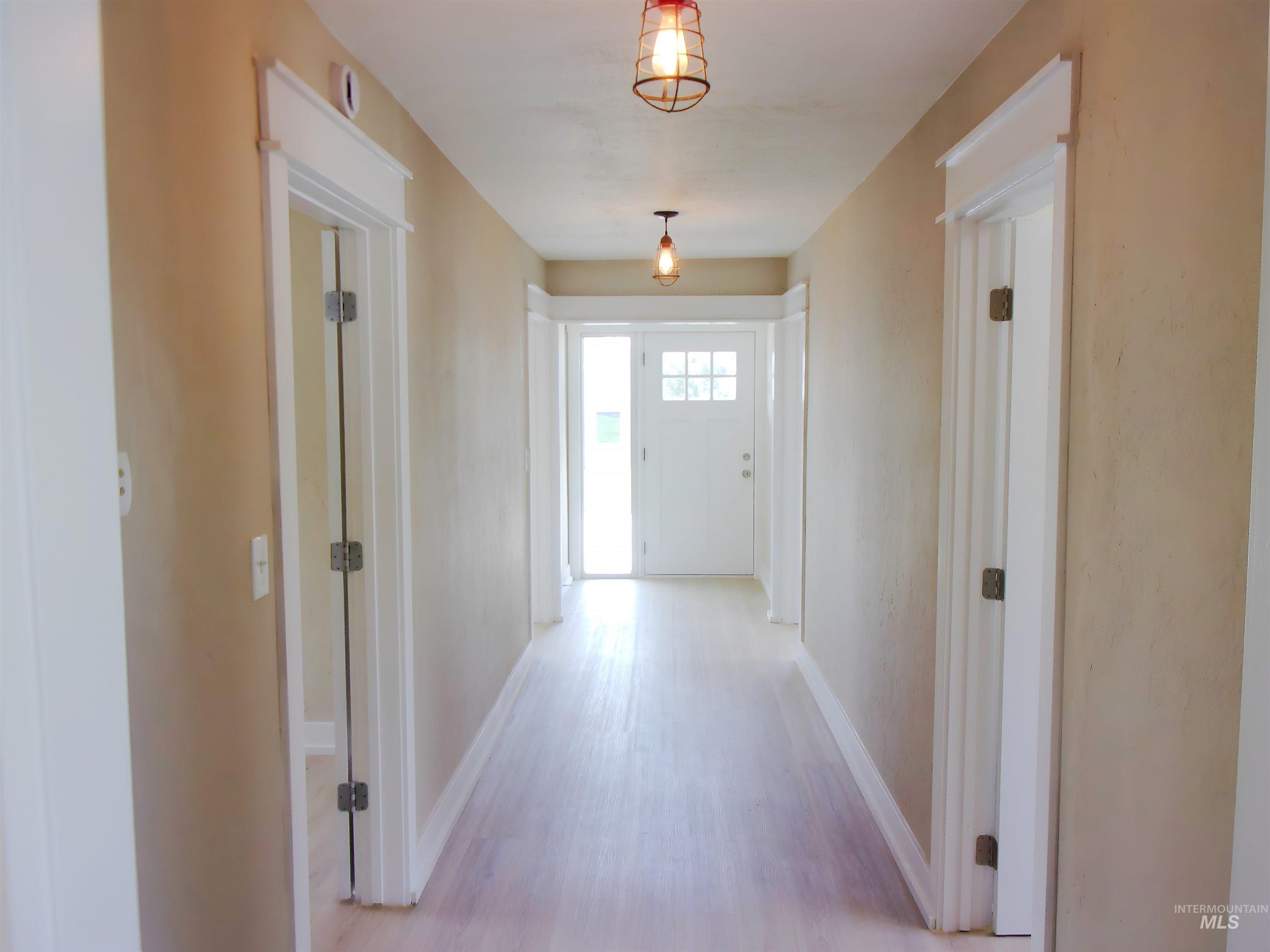 605 North 6th Street Parma, ID 83660 - Photo 25 of 46 Corridor featuring baseboards and light wood-type flooring