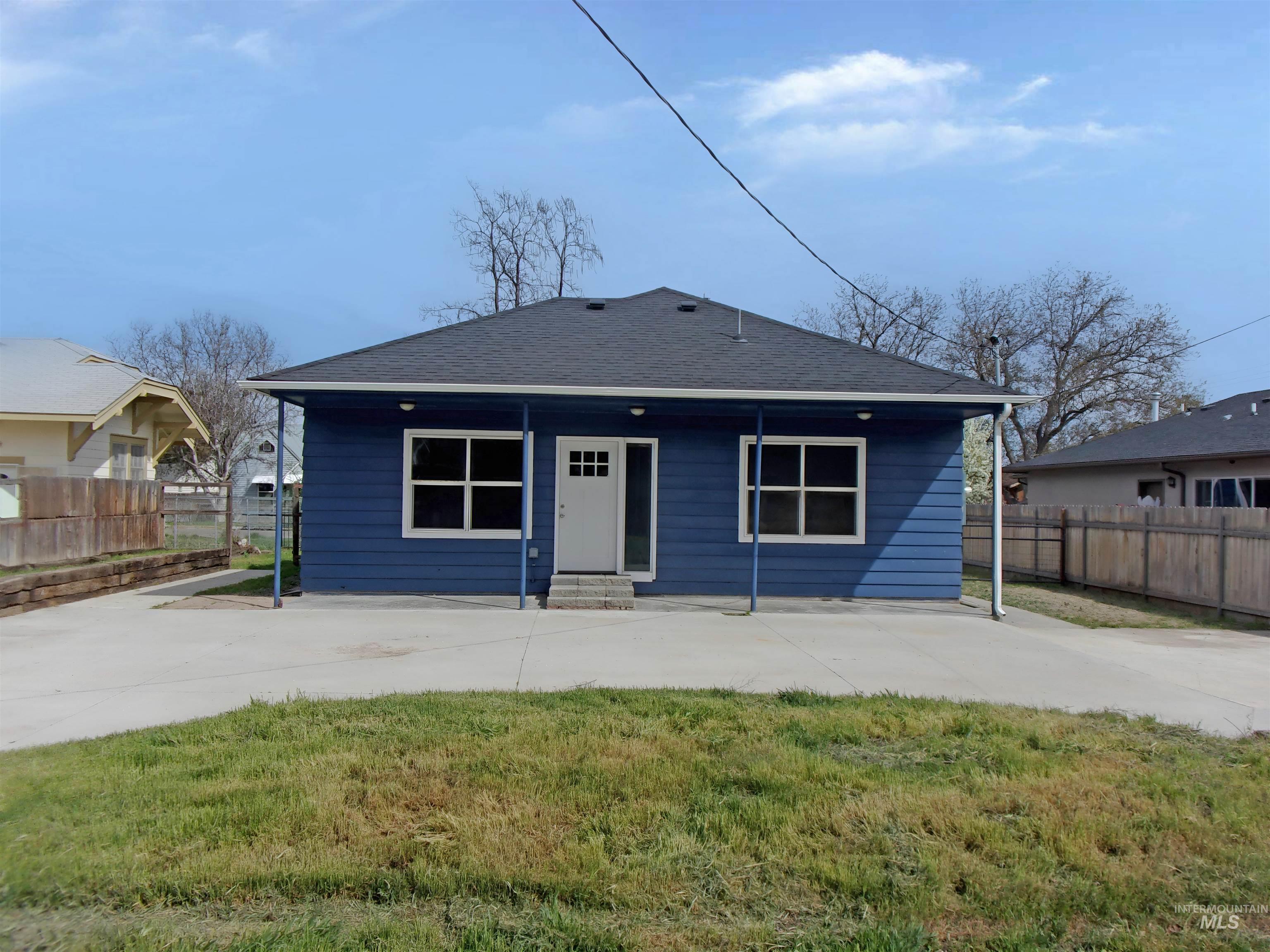 605 North 6th Street Parma, ID 83660 - Photo 42 of 46 View of front facade featuring a shingled roof and a patio area