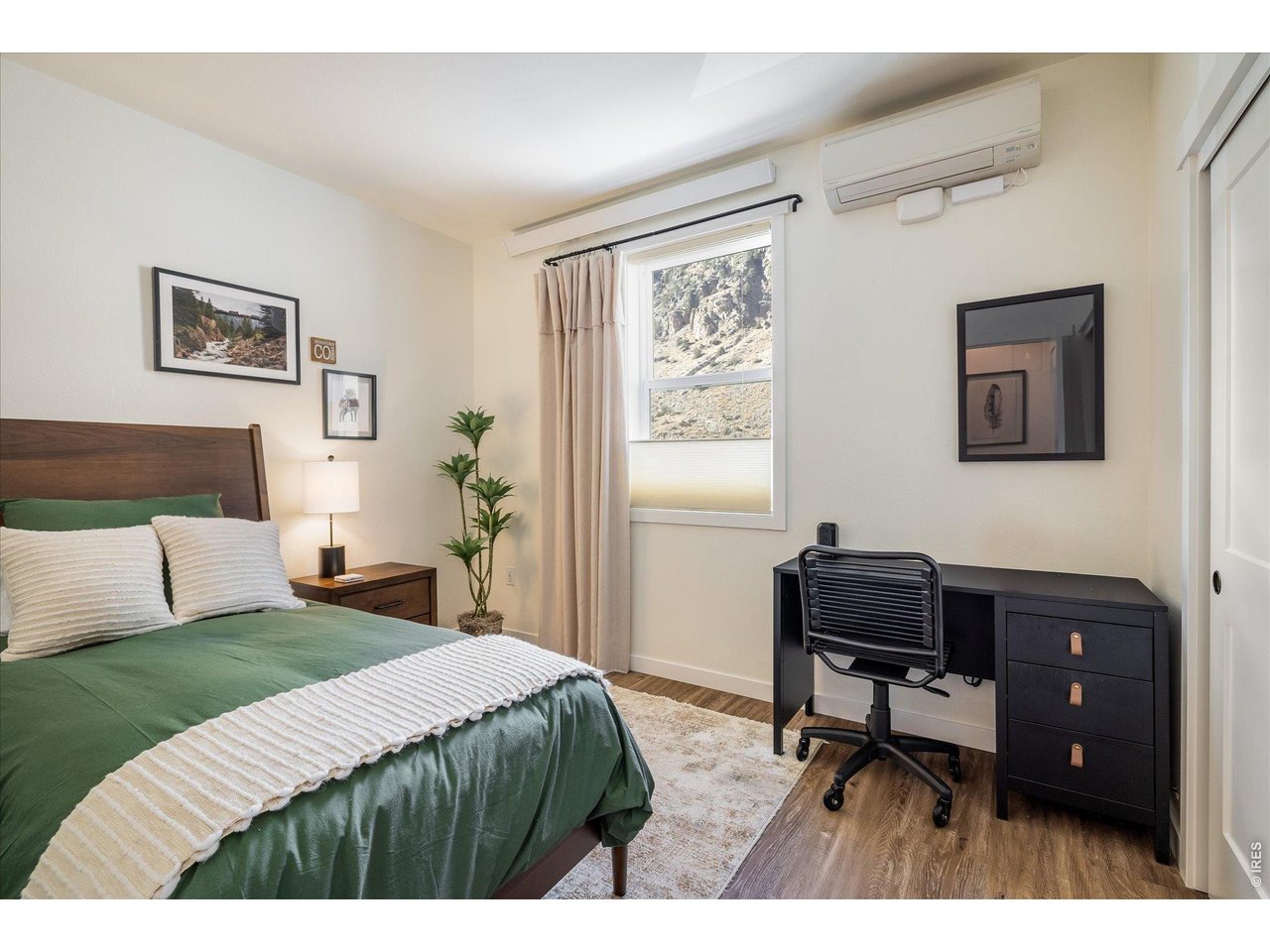 2121 Hummingbird Way, Unit 201 Georgetown, CO 80444 - Photo 12 of 37 a bedroom with a bed table chair and a window