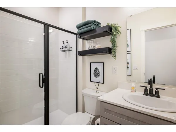a view of a bathroom with wooden floor