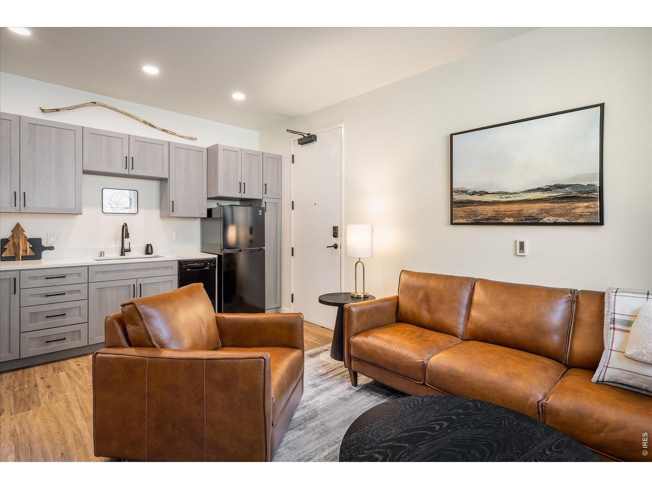 2121 Hummingbird Way, Unit 201 Georgetown, CO 80444 - Photo 5 of 37 a living room with furniture and kitchen view