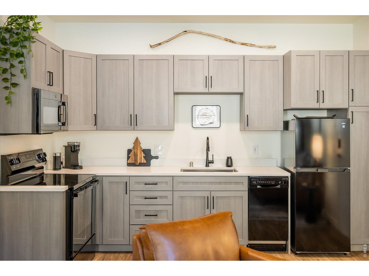 2121 Hummingbird Way, Unit 201 Georgetown, CO 80444 - Photo 6 of 37 a kitchen with a sink appliances and cabinets