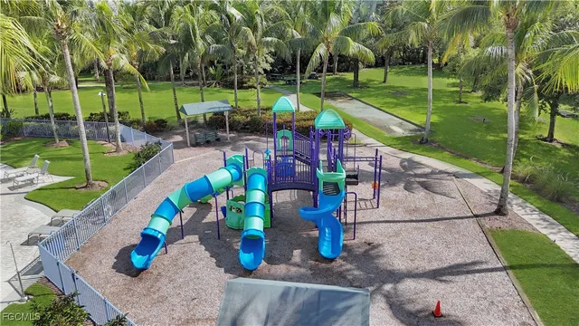 an aerial view of a house with a yard basket ball court and outdoor seating