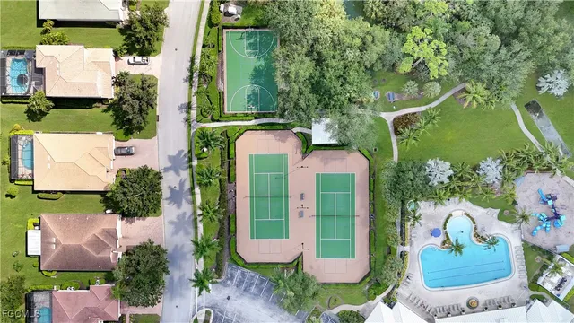 an aerial view of a residential houses with outdoor space