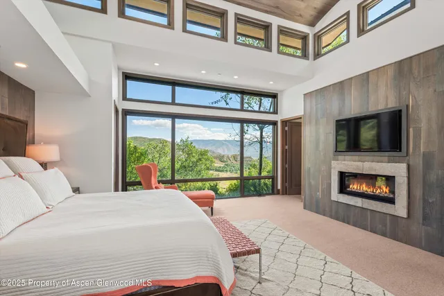 a bathroom with a double vanity sink mirror and shower
