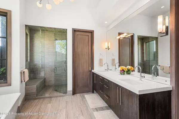 a white bath tub sitting in front of a window