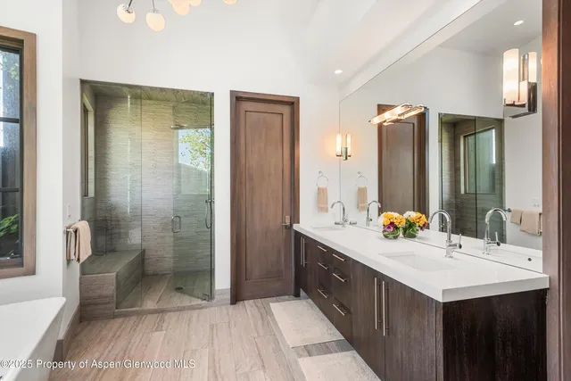 a white bath tub sitting in front of a window