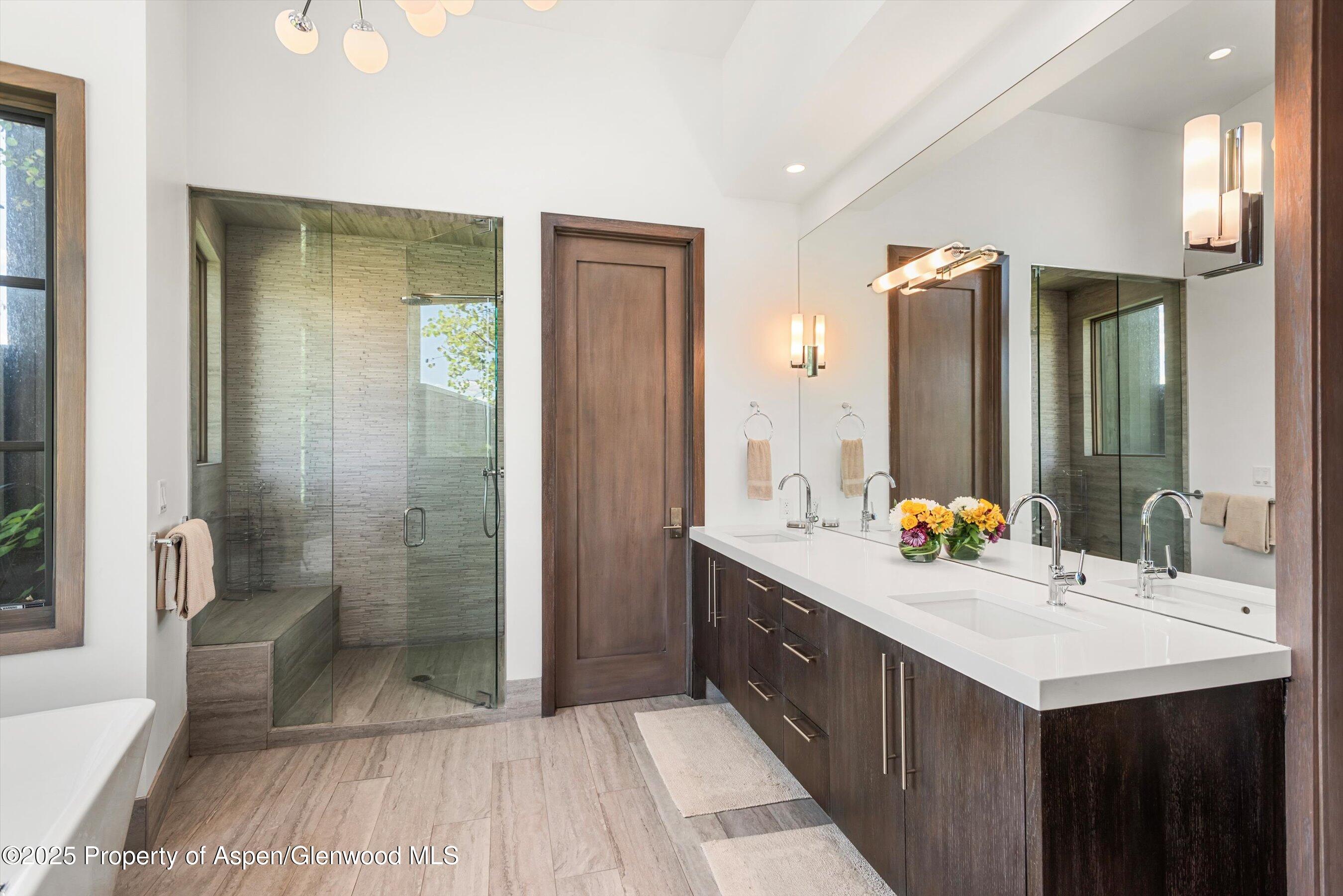 272 Oak Ridge Road Snowmass Village, CO 81615 - Photo 16 of 54 a bathroom with a double vanity sink mirror and shower