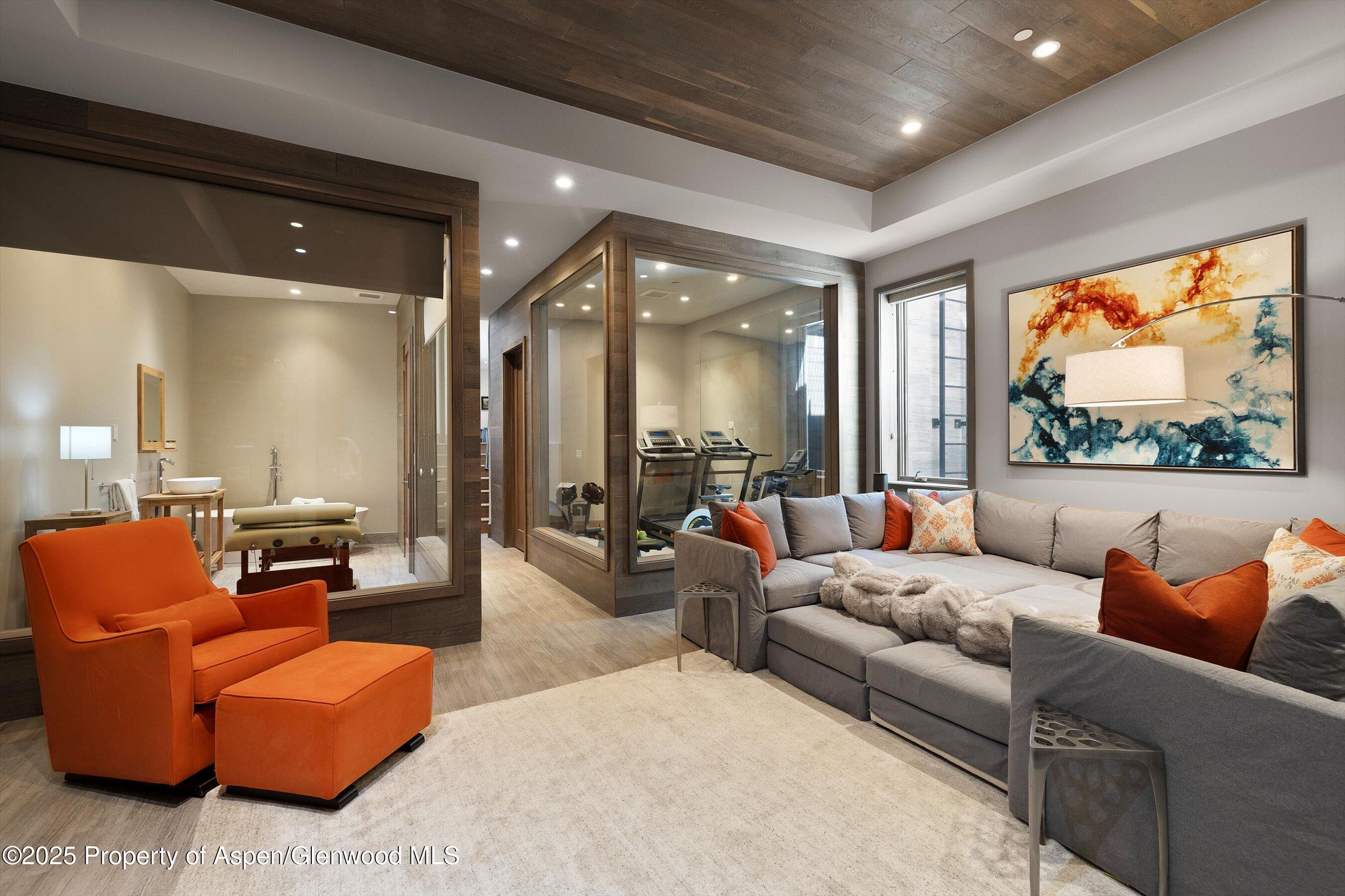 272 Oak Ridge Road Snowmass Village, CO 81615 - Photo 32 of 54 a living room with furniture and a large window