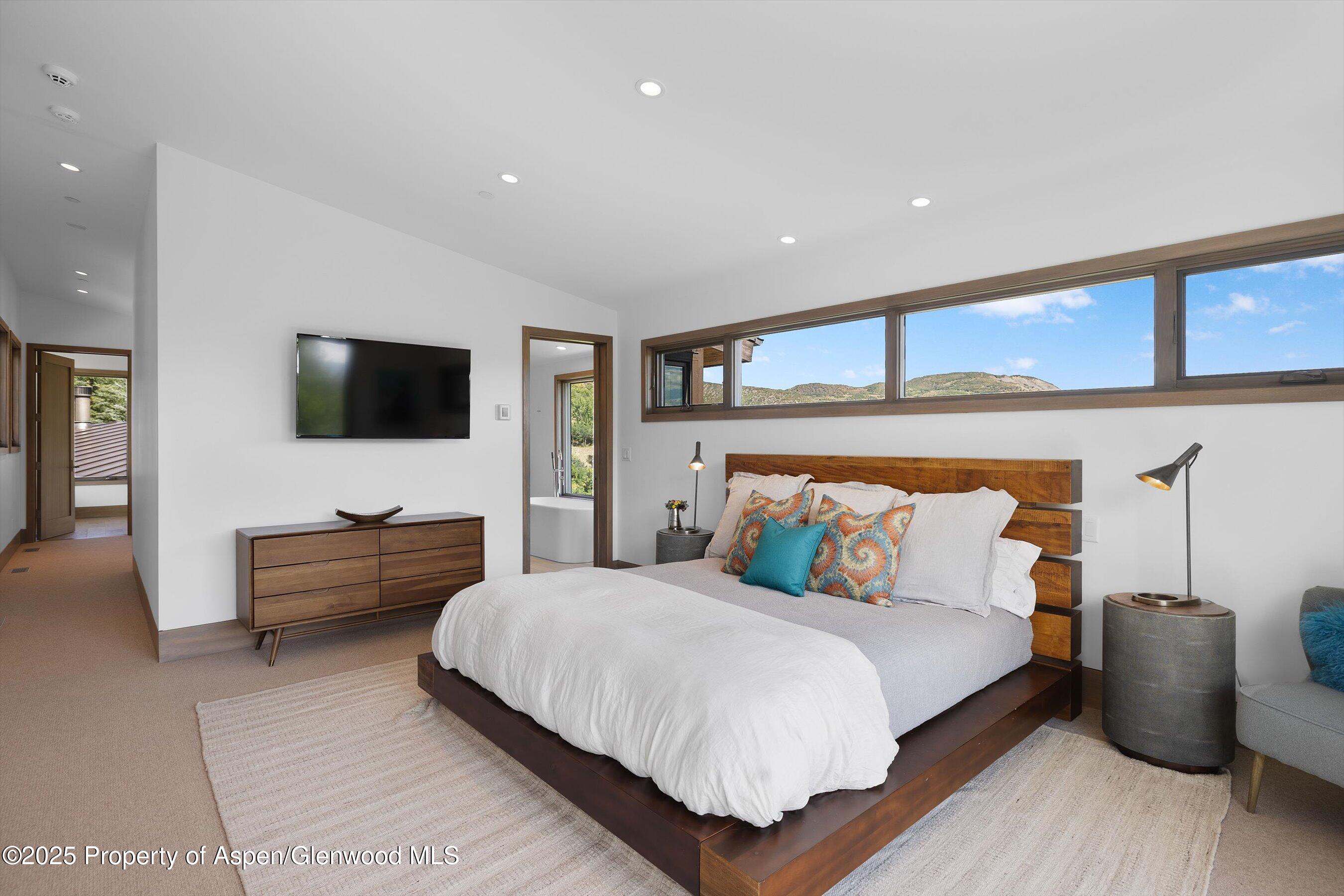 272 Oak Ridge Road Snowmass Village, CO 81615 - Photo 37 of 54 a bedroom with a bed and furniture