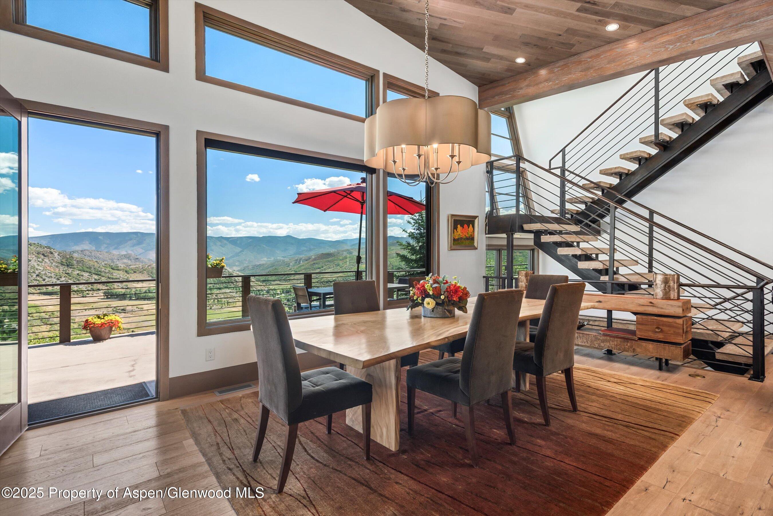 272 Oak Ridge Road Snowmass Village, CO 81615 - Photo 10 of 54 a view of a dining room with furniture window and wooden floor