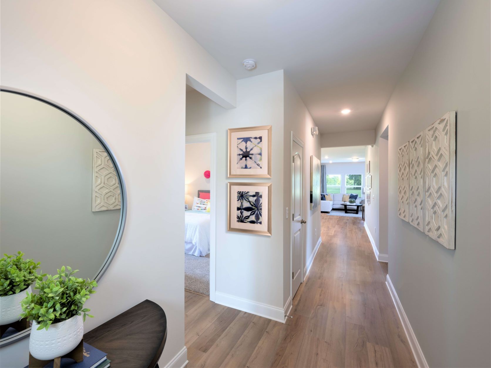 723 Castle Road Mount Juliet, TN 37122 - Photo 10 of 17 a view of a hallway with wooden floor and a potted plant