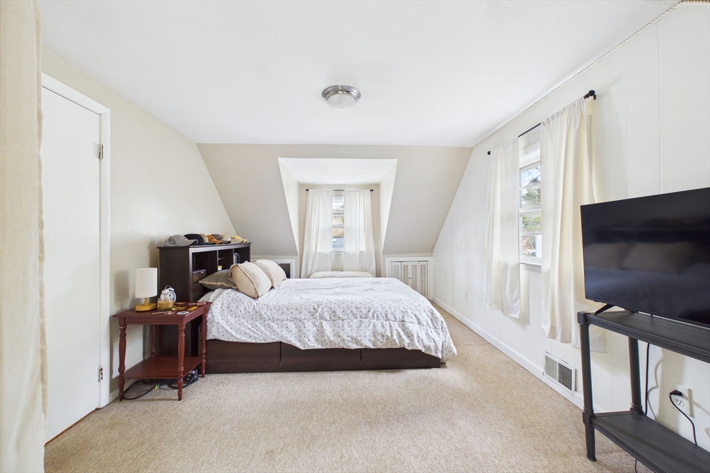 13 Albatross Avenue Wareham, MA 02538 - Photo 20 of 25 a bedroom with a bed and a flat screen tv